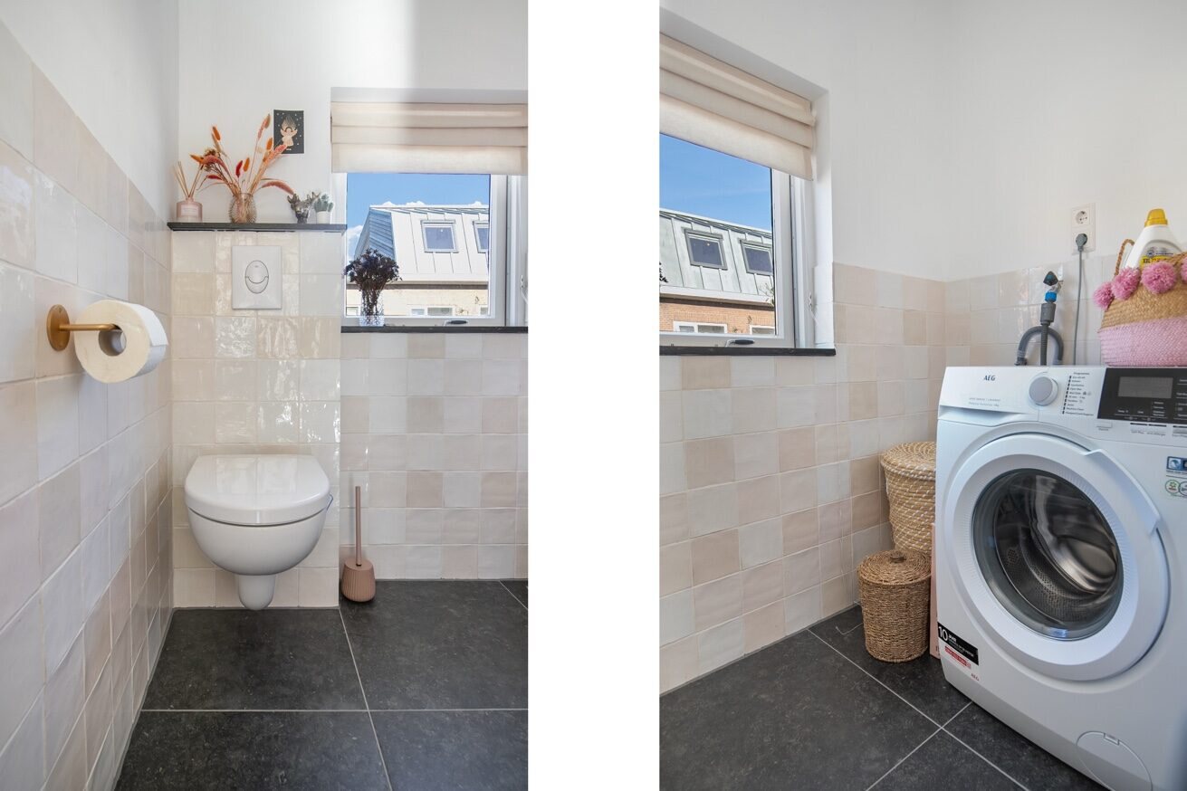 Gerenoveerde toilet- en wasruimte met lichte tegels en donkere vloertegels